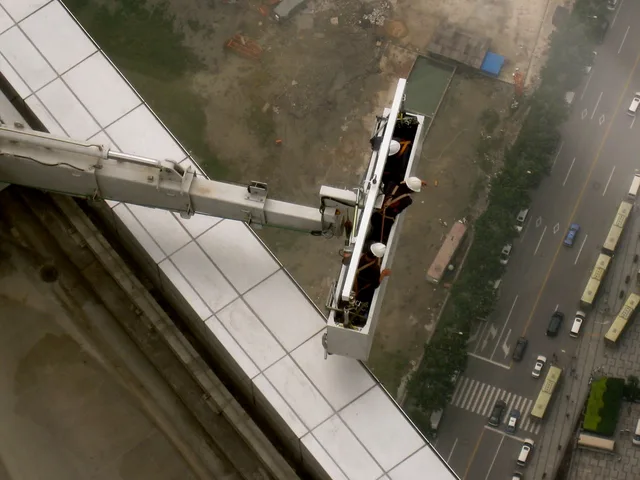 Window washing crew working the glass on the Shanghai World Financial Center http://skyscraperpage.com/cities/?buildingID=7609. Window cleaning quote template: write the scope before the price